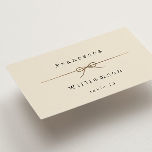 This is a ivory wedding place cards with foil pressed by Baumbirdy called bow tie printing on signature in placecard