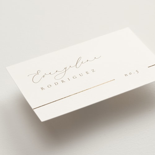 This is a brass wedding place cards with foil pressed by Kelly Schmidt called london printing on signature in placecard
