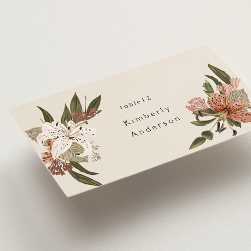 This is a terracotta wedding place cards with foil pressed by Susan Moyal called delicate printing on signature in placecard