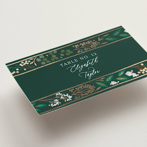 This is a evergreen wedding place cards with foil pressed by Alethea and Ruth called illuminated storybook printing on signature in placecard