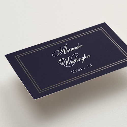 This is a navy wedding place cards with foil pressed by Sarah Brown called traditionalist printing on signature in placecard