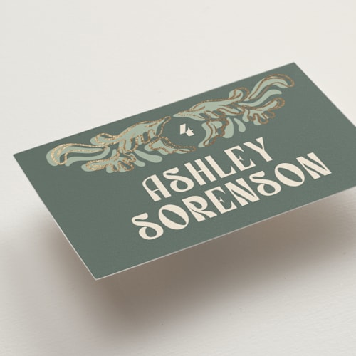 This is a sage wedding place cards with foil pressed by GeekInk Design called nouveau frame printing on signature in placecard