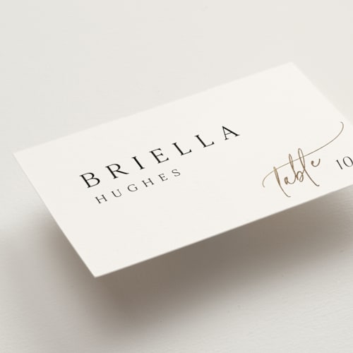This is a marshmallow wedding place cards with foil pressed by Kaydi Bishop called the wedding printing on signature in placecard