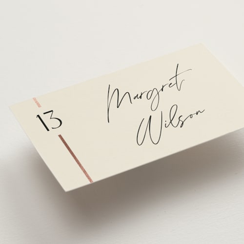 This is a cream puff wedding place cards with foil pressed by Pixel and Hank called together printing on signature in placecard