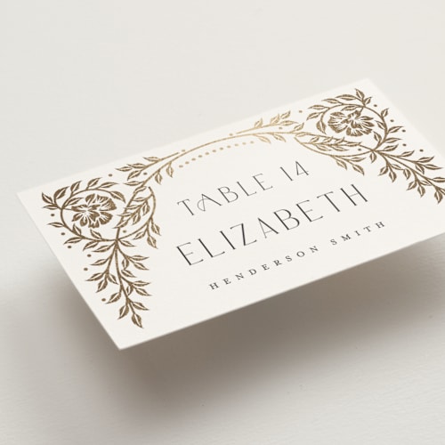 This is a ivory wedding place cards with foil pressed by Ana de Sousa called gilded nouveau frame printing on signature in placecard