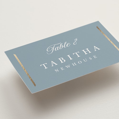 This is a dusty blue wedding place cards with foil pressed by Stacey Meacham called elegant bevel printing on signature in placecard