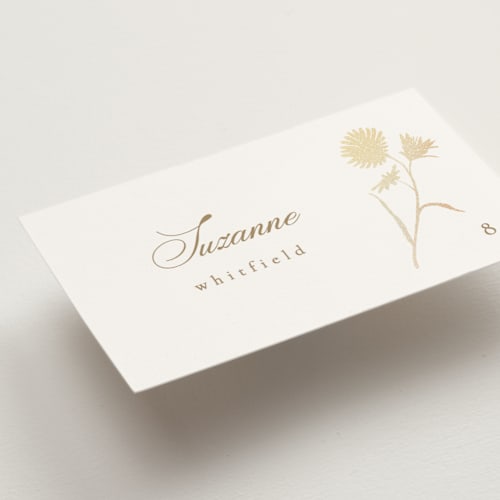 This is a buttercream wedding place cards with foil pressed by Kristie Kern called the romantic printing on signature in placecard