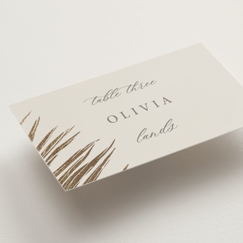 This is a sand wedding place cards with foil pressed by Melinda Denison called gilded palm printing on signature in placecard