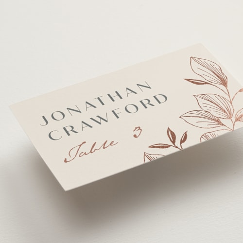 This is a creme wedding place cards with foil pressed by Stardust Design Studio called lovely printing on signature in placecard