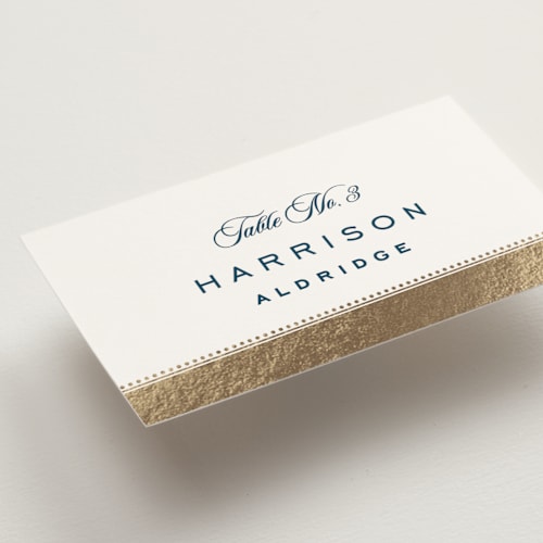 This is a royal navy wedding place cards with foil pressed by Olivia Raufman called anchored printing on signature in placecard