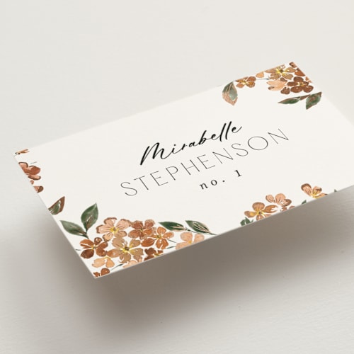 This is a terracotta wedding place cards with foil pressed by Itsy Belle Studio called sweeping vine printing on signature in placecard