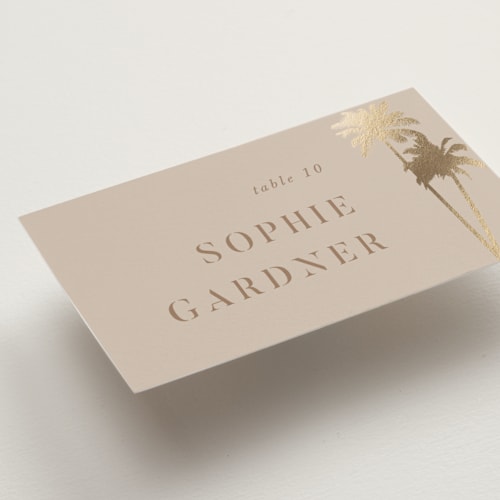 This is a tan wedding place cards with foil pressed by lulu and isabelle called sunset by the sea printing on signature in placecard