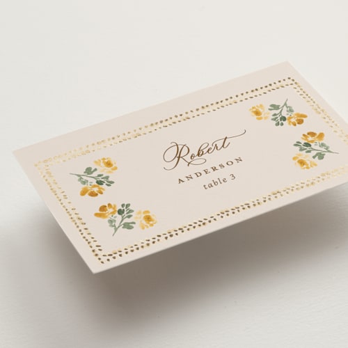 This is a golden wedding place cards with foil pressed by Claudia Orengo called tuileries printing on signature in placecard