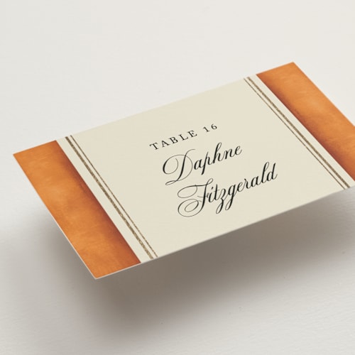 This is a tangerine wedding place cards with foil pressed by Jackie Crawford called josephine printing on signature in placecard
