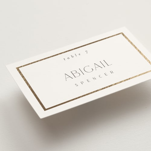 This is a porcelain wedding place cards with foil pressed by Nicole Walsh called regal printing on signature in placecard
