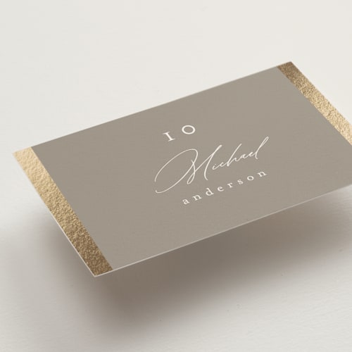 This is a khaki wedding place cards with foil pressed by Nicole Walsh called surround printing on signature in placecard