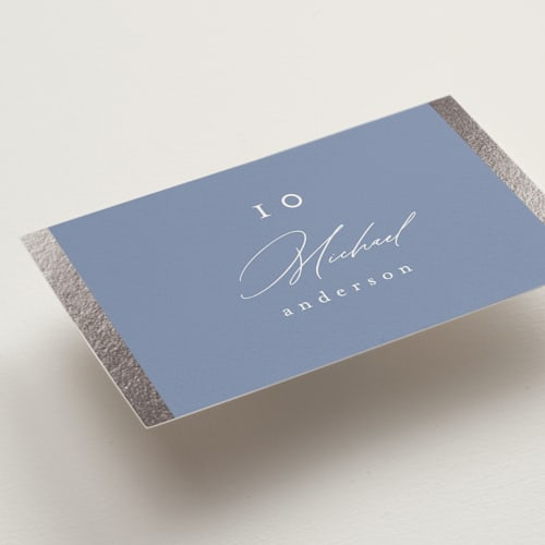 This is a cornflower blue wedding place cards with foil pressed by Nicole Walsh called surround printing on signature in placecard