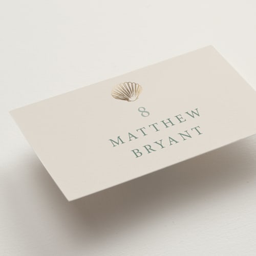This is a kelp wedding place cards with foil pressed by Hannah Bowman called simple seashell printing on signature in placecard