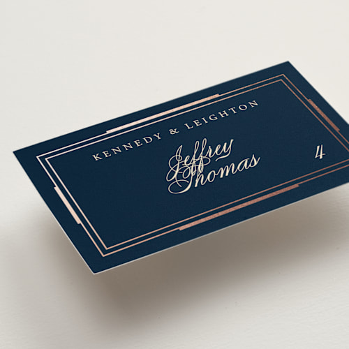 This is a navy wedding place cards with foil pressed by Hooray Creative called opulent border printing on signature in placecard