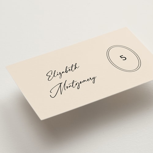This is a sand wedding place cards with standard by Carolyn MacLaren called script and monogram printing on signature in placecard
