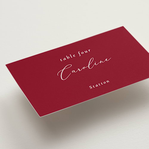This is a crimson wedding place cards with standard by Corinne Malesic called bow printing on signature in placecard