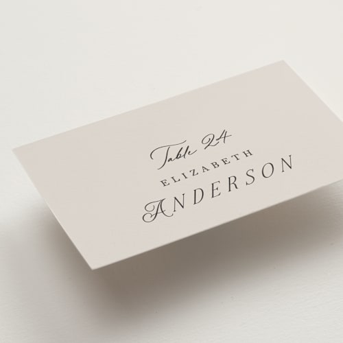 This is a stone wedding place cards with standard by Phrosné Barwood called etched floral printing on signature in placecard
