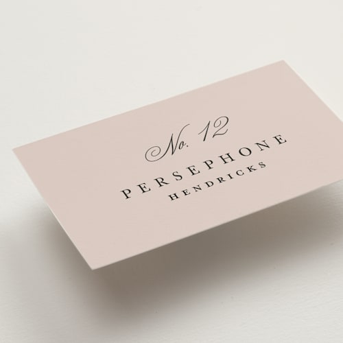 This is a dusty rose wedding place cards with standard by Kelly Schmidt called arch monogram printing on signature in placecard
