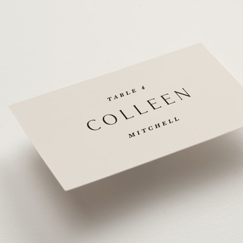 This is a almond wedding place cards with standard by Olivia Kanaley Inman called blockprint printing on signature in placecard