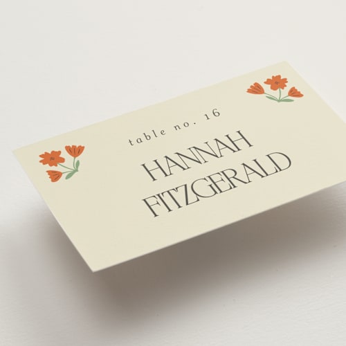 This is a coral wedding place cards with standard by Morgan Kendall called vintage wildflowers printing on signature in placecard