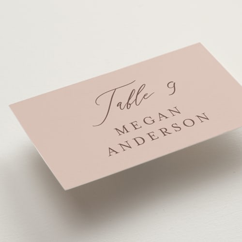 This is a blush wedding place cards with standard by Lucrecia Caporale called delicate monogram printing on signature in placecard