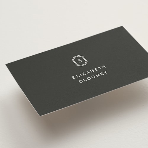 This is a charcoal wedding place cards with standard by Megan Davis called upper east printing on signature in placecard