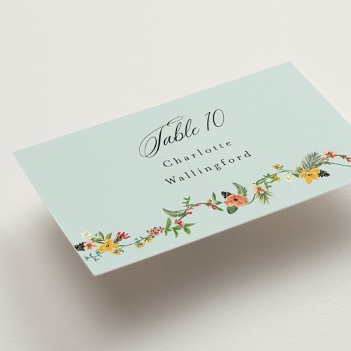 This is a papaya wedding place cards with standard by Susan Moyal called tropical crest printing on signature in placecard