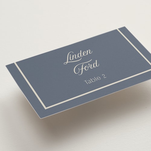 This is a french blue wedding place cards with standard by Nicoletta Savod called ritzy printing on signature in placecard