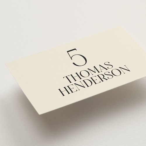 This is a cream wedding place cards with standard by Baumbirdy called floral emblem printing on signature in placecard