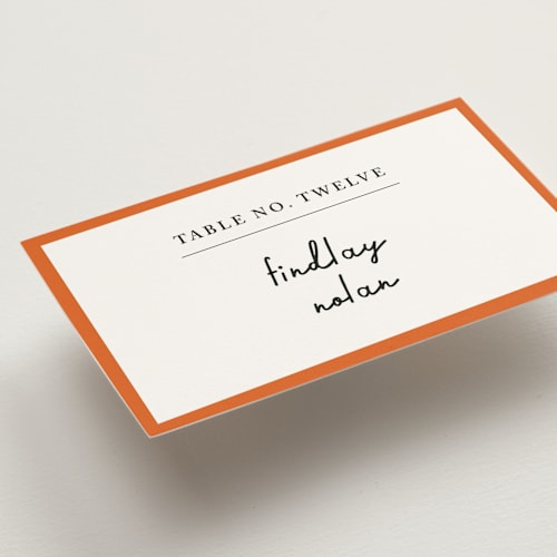 This is a peach wedding place cards with standard by mo kelley called swirl frame printing on signature in placecard