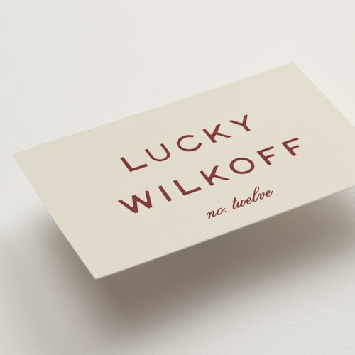 This is a rust wedding place cards with standard by Ani Somi called rose ink printing on signature in placecard