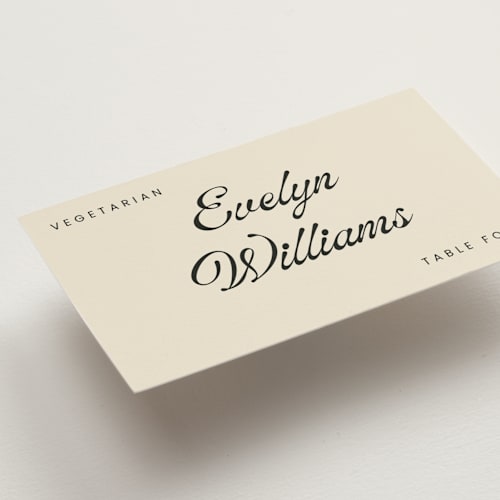 This is a cream wedding place cards with standard by Stacy Maalouf called vintage printing on signature in placecard