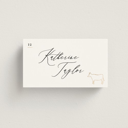 This is a ivory wedding place cards with foil pressed by Creo Study called gilded icons printing on signature in placecard