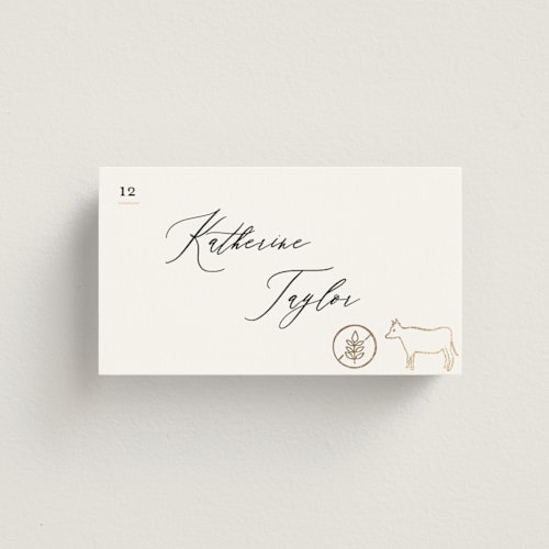 This is a ivory wedding place cards with foil pressed by Creo Study called gilded icons printing on signature in placecard
