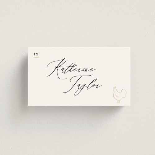 This is a ivory wedding place cards with foil pressed by Creo Study called gilded icons printing on signature in placecard
