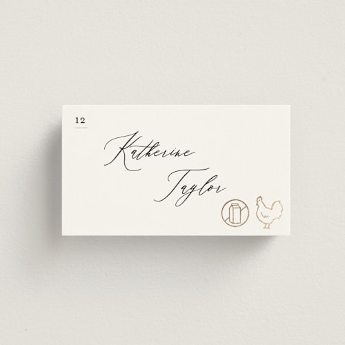 This is a ivory wedding place cards with foil pressed by Creo Study called gilded icons printing on signature in placecard