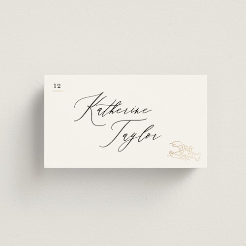 This is a ivory wedding place cards with foil pressed by Creo Study called gilded icons printing on signature in placecard