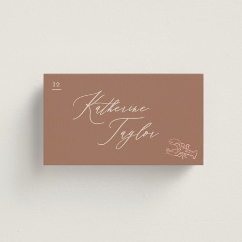 This is a mocha wedding place cards with foil pressed by Creo Study called gilded icons printing on signature in placecard