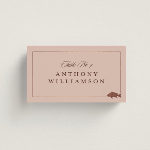This is a salmon wedding place cards with foil pressed by Stacy Maalouf called foil meal silhouettes printing on signature in placecard
