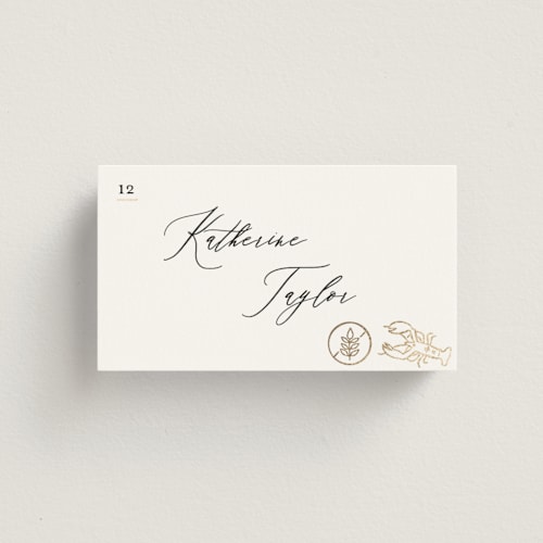 This is a ivory wedding place cards with foil pressed by Creo Study called gilded icons printing on signature in placecard
