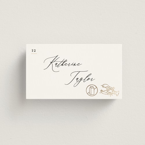This is a ivory wedding place cards with foil pressed by Creo Study called gilded icons printing on signature in placecard