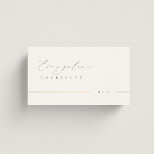 This is a brass wedding place cards with foil pressed by Kelly Schmidt called london printing on signature in placecard