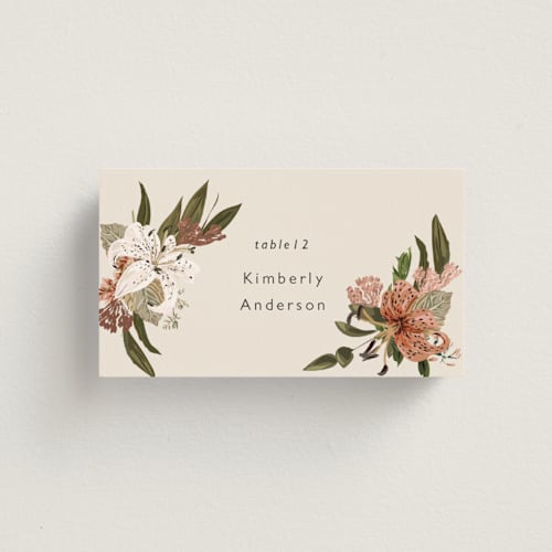 This is a terracotta wedding place cards with foil pressed by Susan Moyal called delicate printing on signature in placecard