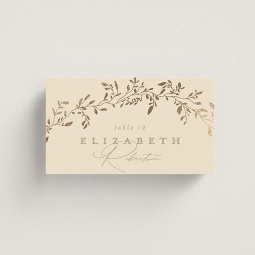 This is a sand wedding place cards with foil pressed by Creo Study called leafy garland printing on signature in placecard