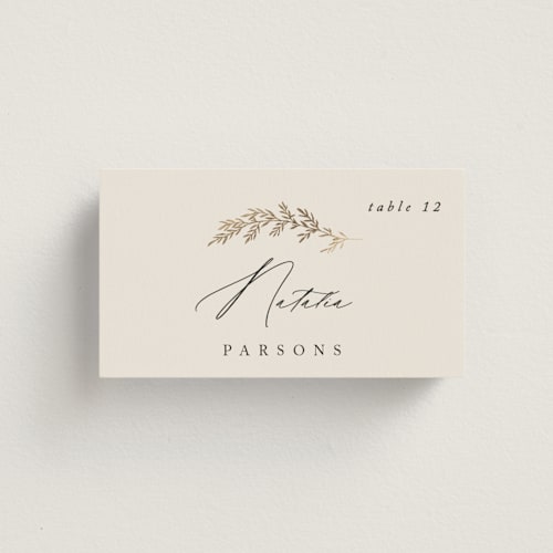 This is a ivory wedding place cards with foil pressed by Carolyn Nicks called to hold printing on signature in placecard